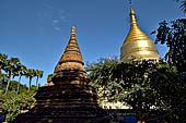 Bagan Myanmar. Next to the Gubyaukgyi stands the gilded Myazedi or 'Emerald Stupa'. 